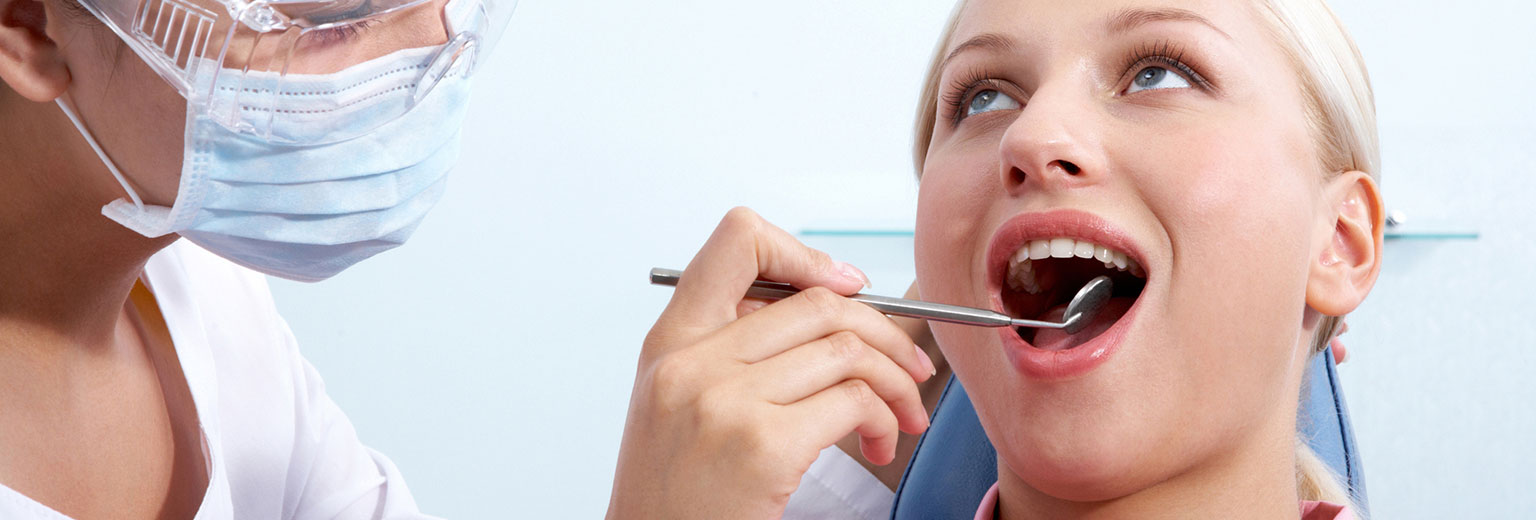 Lady having a tooth filling treatment